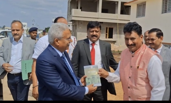 Justice Shivraj Patil receives book gift from Dr. Biradar