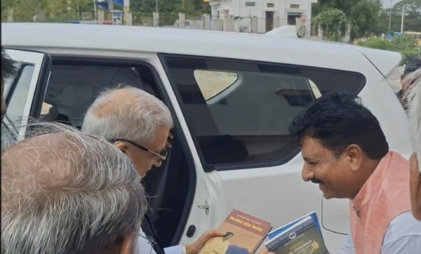 Justice Shivraj Patil receives book gift from Dr. Biradar